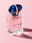 blue cap gold ring on cap, blue ring around cap, pink bottle, MY WAY in blue, GIORGIO ARMANI in blue, pink background